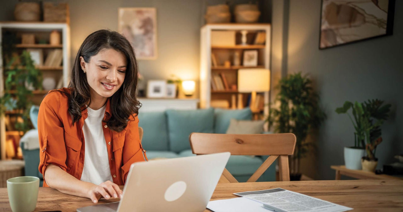Woman sitting working on here computer